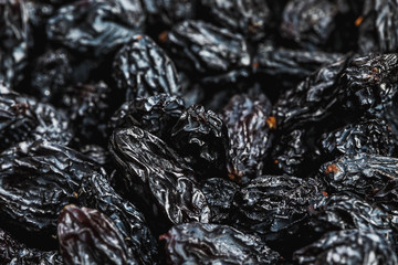 Black Raisin texture, popular dried fruit. Dried grapes.