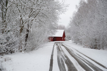 Red winter cabin at the end of the road 