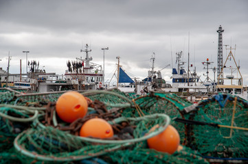 fishing nets and boats in harbour