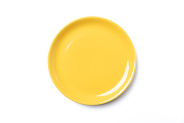 Pastel yellow plate isolated on white background