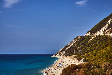 Obraz premium Sandy beach and rocky cliff on the Greek island of Lefkada.
