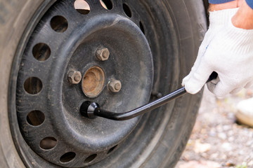 Mount the wheels on the car. Socket wrench.