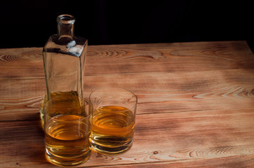 Obraz na płótnie Canvas Glasses for whiskey on a wooden table