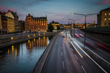 Fototapeta na wymiar Rushing cars on Centralbron bridge, Gamla Stan, Stockholm, Sweden