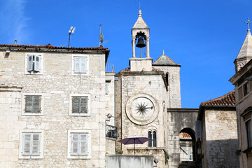 Historic buildings in Split, Croatia with landmark city clock. Split is popular coastal travel destination.