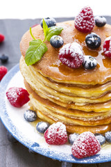 Pancakes with honey and berries