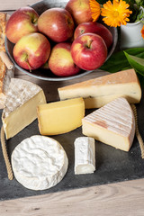 different french cheeses with apples