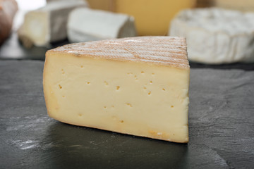 french Morbier cheese on a slate plate