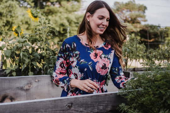 Woman checking on her plants