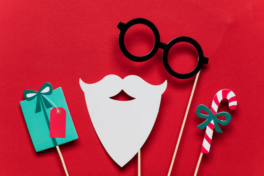 Christmas photo booth props on a red background