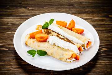 Sweet crepes with apricots