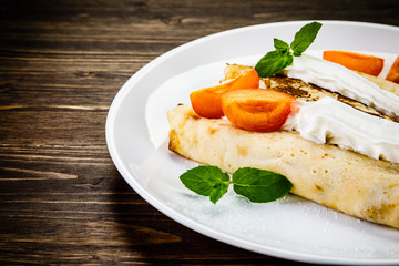 Sweet crepes with apricots
