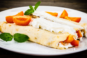 Sweet crepes with apricots