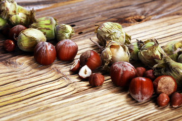 hazelnut with shell and craked and hazelnut leaves.