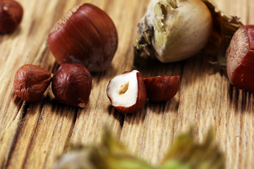 hazelnut with shell and craked and hazelnut leaves.