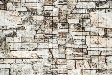 The texture of their layered stone on the fence. Stone texture