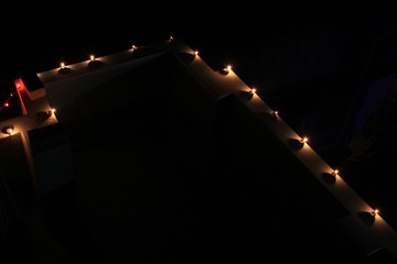 Earthen diya lamp lighting with candles on the occasion of diwali and sandhi pujo.