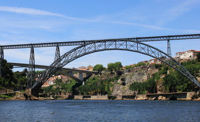 Embankment of Douro River with Bridge of Luis I and Prince Henry Bridge in Porto, Portugal