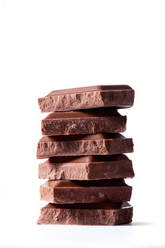 Chocolate bars stacked on white backround. Hero shot