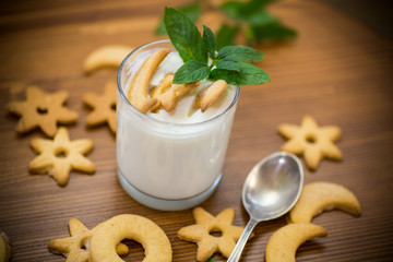 sweet homemade yogurt with cookies in a glass cup