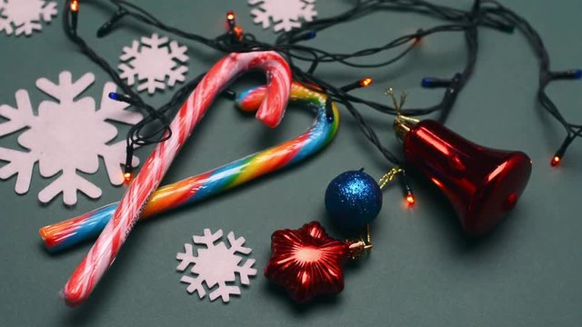 Christmas lights, lollipops nd new Year decoration on wooden background