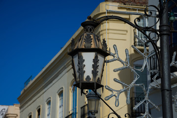 Fototapeta na wymiar Street lamp and christmas decoration. Ronda, Spain