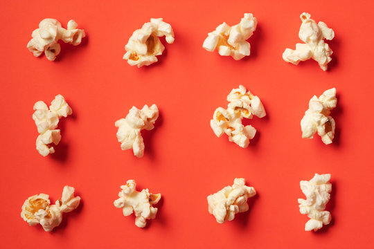 Popcorn pattern on red background. Top view