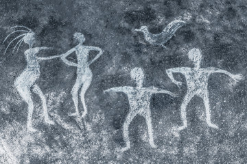 image of ancient people on the cave wall. ancient art, history of antiquities.