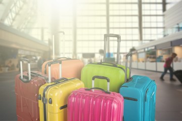 Many multi-colored big suitcases