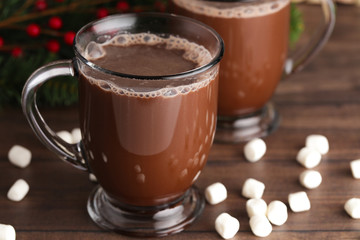 Pair of Mugs Filled with Hot Chocolate and Marshmallows on a Wooden Table