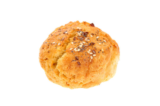 Traditional Bulgarian breakfast called "Dobrudzhanka" (from Dobrudzha region in Bulgaria). Small bread like soda cake stuffed with cheese, sprinkled with seeds mixture, isolated on white background