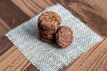 Wholemeal biscuits made emc, on wooden table. Homemade cookie, very tasty.