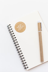 Blank notebook, pen and keyboard on white background