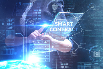 The concept of business, technology, the Internet and the network. A young entrepreneur working on a virtual screen of the future and sees the inscription: smart contract