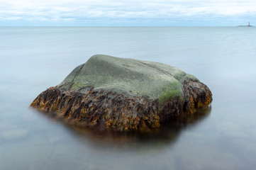 Lonely rock in water