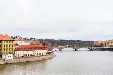 View to Vitava river in Prague from Charles Bridge. Manes Bridge.  Czech Republic