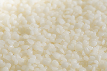 Background of encaustic medium of bees wax pellets