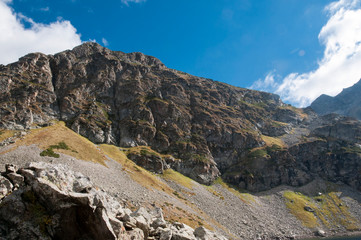 mountain autumn slope without trees on a Sunny day.