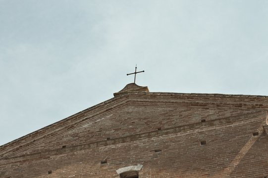 Crucifix on the chutch roof (Tolentino, Italy, Europe)