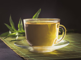 Cup of hot tea on dark background. Chinese tea concept.