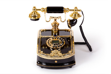 Vintage styled telephone on white background