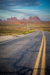The road leading to Monument Valley, an area of giant red rock formations on the Arizona and Utah border, at sunrise