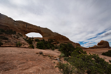 Wilson Arch, located in Dry Valley Utah, is an entrada standstone rock formation in the desert
