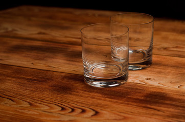 Glasses for whiskey on a wooden table