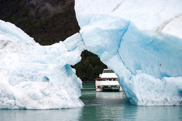 Sailing between icebergs floating in the water