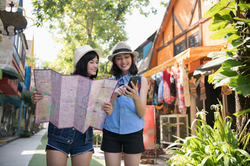 Travel Concept. Beautiful girls are happy to travel. Beautiful girls are finding a tourist spot on...