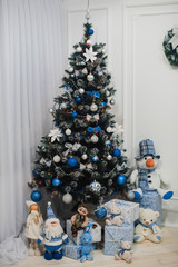 A beautiful living room decorated for Christmas with Christmas tree and presents under it