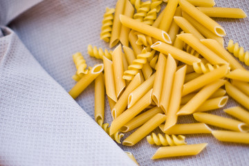 Raw Pasta on beige napkin many different