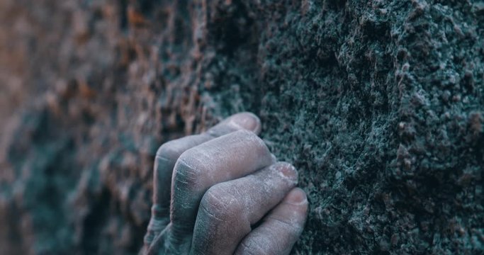 Close up on chalk hands of climber athlete