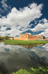 Fototapeta na wymiar Fagaras fortress mirrored in the water